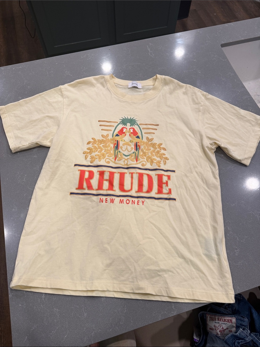 Rhude Cream Graphic Tee with Red Logo and Gold Crest New Money